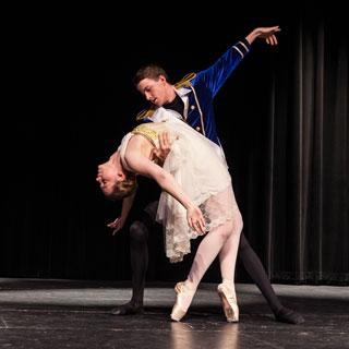 Two students, a man and a woman, dance in a ballet