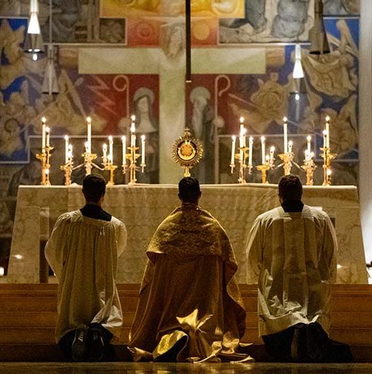 BCYC Encounter adoration priest and two altarboys kneeling